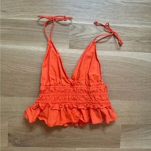 Bright orange cami, low back top